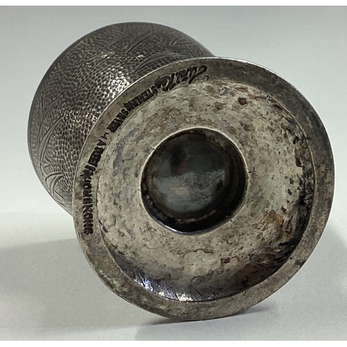 98 - A Chinese silver hammered egg cup with engraved bamboo decoration. Marked to base. Approx. 42 grams.... 