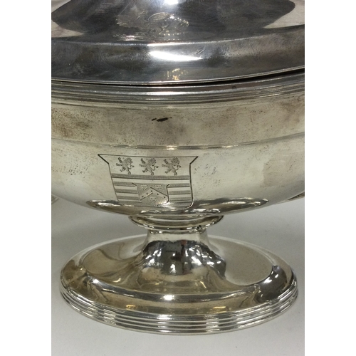 700 - A fine pair of George III silver sauce tureens with crested sides. 1800. By Timothy Renou. Approx. 1... 