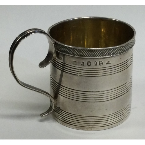 713 - A heavy Georgian silver reeded mug with engine turned decoration. London. By NW. Approx. 80 grams. E... 