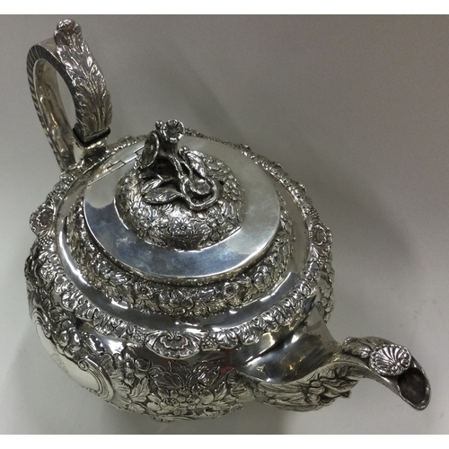 156 - DUBLIN: A George IV Irish silver tea service with crested decoration. 1822. By James Scott. Approx. ... 