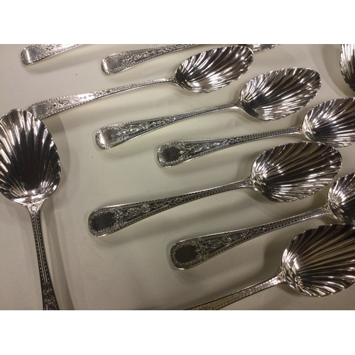 568 - A good set of ten George III bright-cut silver dessert spoons with fluted bowls. By Crossley, Eley &... 