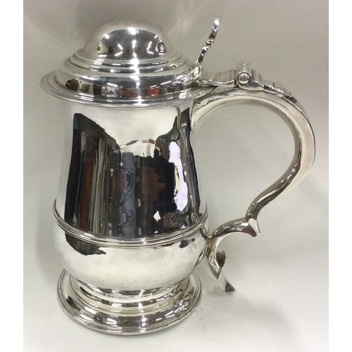 255 - A George II silver baluster tankard with dome shaped lid. London 1753. By William Shaw & William Pri... 