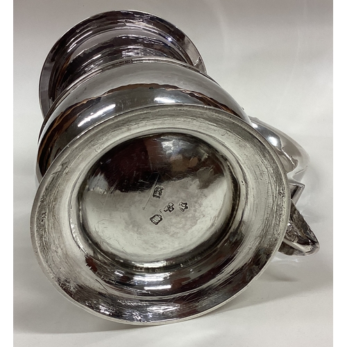 255 - A George II silver baluster tankard with dome shaped lid. London 1753. By William Shaw & William Pri... 