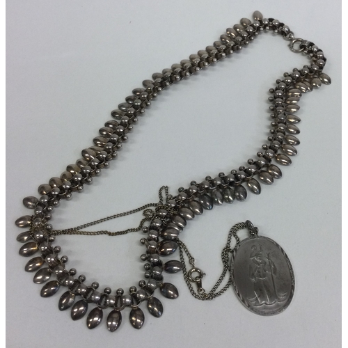 809 - A silver mounted collar together with a pendant. Approx. 47 grams. Est. £20 - £30.