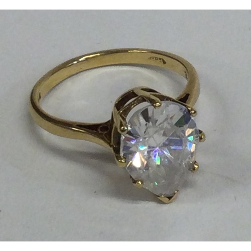 815 - A small pear-shaped single stone ring in 18 carat gold setting. Approx. 5 grams. Est. £100 - £150.