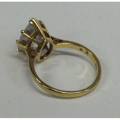 815 - A small pear-shaped single stone ring in 18 carat gold setting. Approx. 5 grams. Est. £100 - £150.