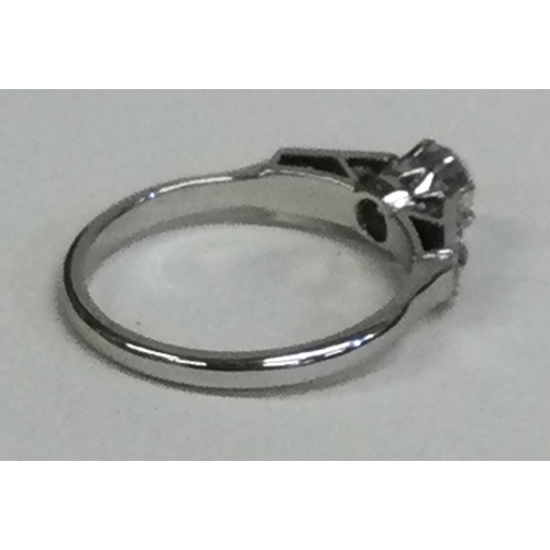 820 - An attractive diamond single stone ring in claw mount to diamond shoulders. Approx. 4 grams. Est. £4... 