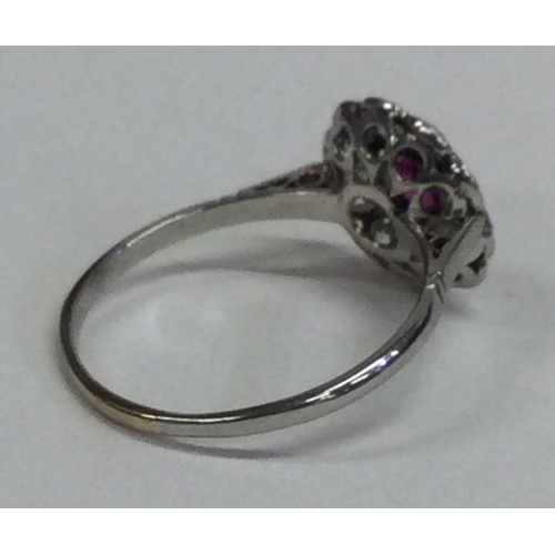 822 - An attractive Victorian ruby daisy head cluster ring. Approx. 3 grams. Est. £300 - £400.