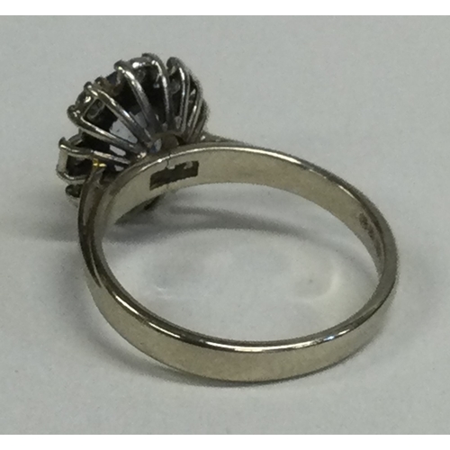 823 - An 18 carat gold diamond set circular cluster ring. Approx. 5 grams. Est. £300 - £400.