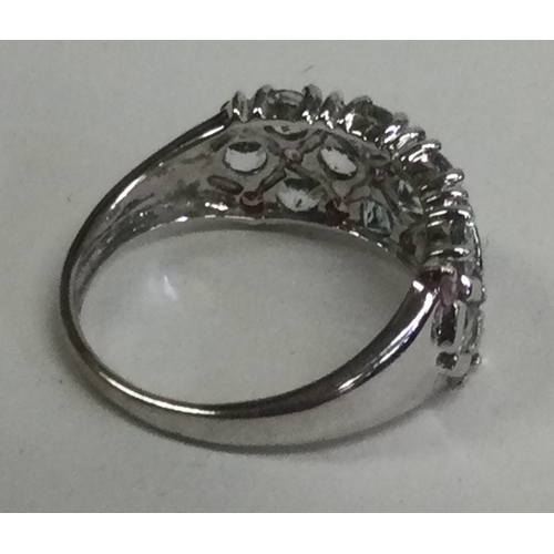 848 - A large white gold three row ring. Approx. 3 grams. Est. £50 - £80.