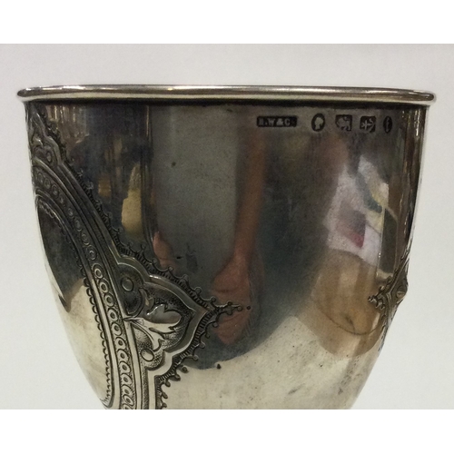 433 - A good Victorian silver goblet with chased decoration. Birmingham. Approx. 99 grams. Est. £100 - £20... 