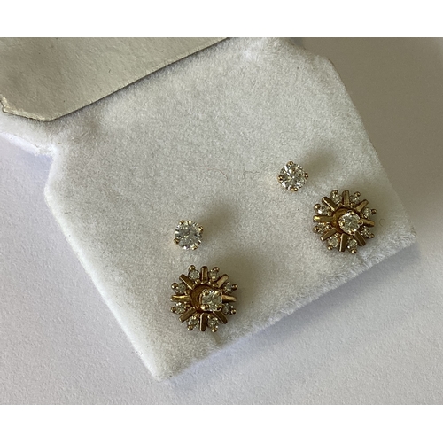 799 - A good pair of small diamond single stone ear studs together with a pair of diamond cluster earrings... 