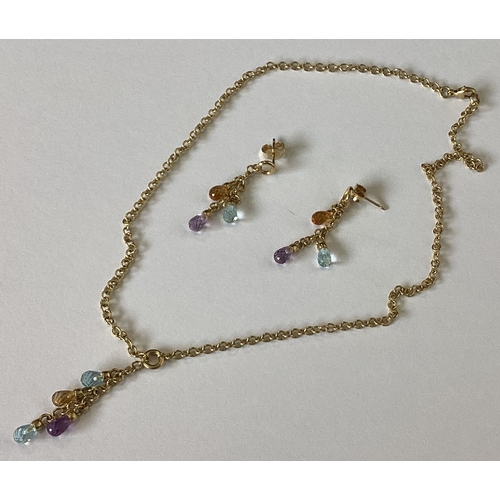 852 - A 9 carat gem set necklace together with matching ear pendants. Approx. 8 grams. Est. £100 - £150.