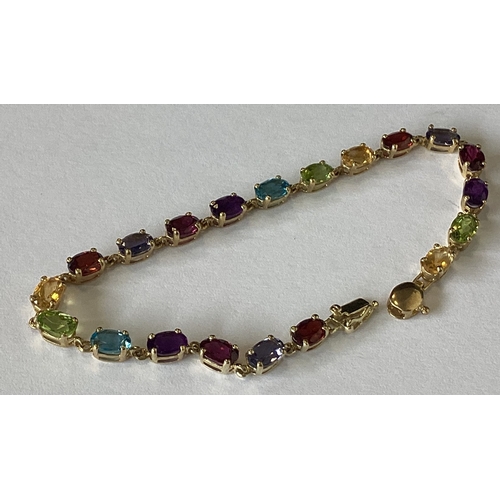 857 - A good 9 carat multi gem set bracelet with concealed clasp. Approx. 5 grams. Est. £50 - £80.