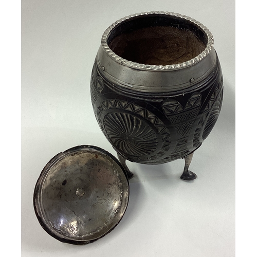 100 - A Continental Georgian silver mounted coconut cup with lift-off cover. Approx. 277 grams of gross we... 