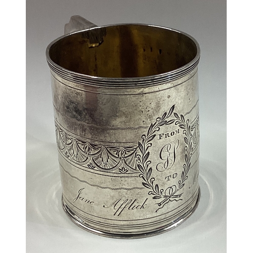 107 - A Georgian silver mug with bright-cut decoration. London 1800. Approx. 70 grams. Est. £100 - £150.