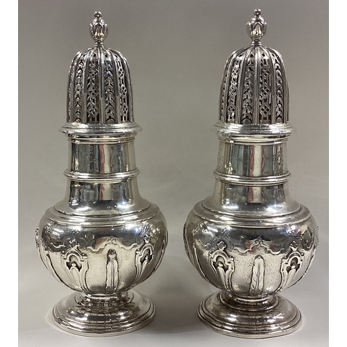 111 - A fine and heavy pair of George II silver casters of good gauge. London 1731. By John Millington. Ap... 