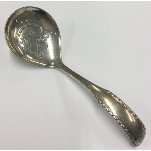 115 - GEORG JENSEN: A pierced silver ladle. Approx. 53 grams. Est. £60 - £80.