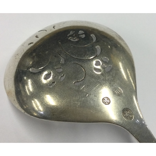 115 - GEORG JENSEN: A pierced silver ladle. Approx. 53 grams. Est. £60 - £80.