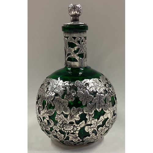 126 - WANG HING: A Chinese export silver mounted and green glass scent bottle. Marked to base. Est. £80 - ... 