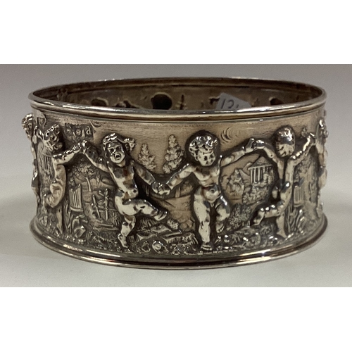 136 - A chased silver potato ring embossed with figures. London 1896. Approx. 67 grams. Est. £60 - £80.