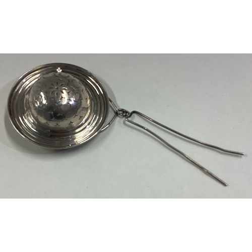 148 - A French silver tea strainer. Marked to side. Approx. 8 grams. Est. £40 - £60.