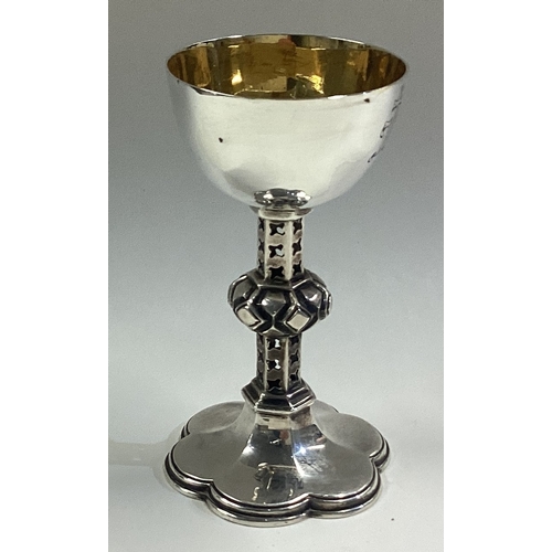 181 - A Victorian silver communion goblet with pierced stem. Sheffield 1855. By Henry Worrace & Co. Approx... 