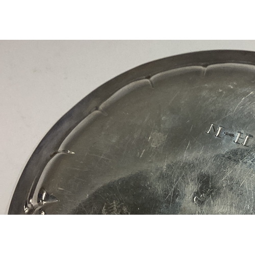 195 - An 18th Century Irish Provincial silver counter dish. Maker's mark only. Approx. 90 grams. Est. £200... 