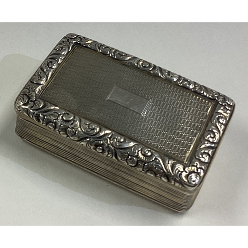 196 - A Georgian silver table snuff box with engine turned decoration. Birmingham 1824. By Joseph Wilmore.... 