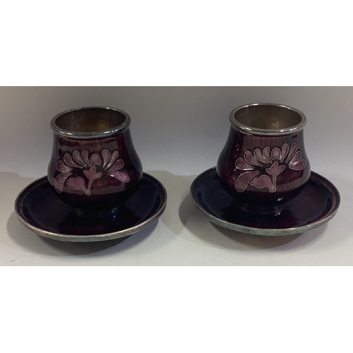 197 - A pair of Asian silver and purple enamelled shot cups on matching saucers. Approx. 200 grams. Est. £... 