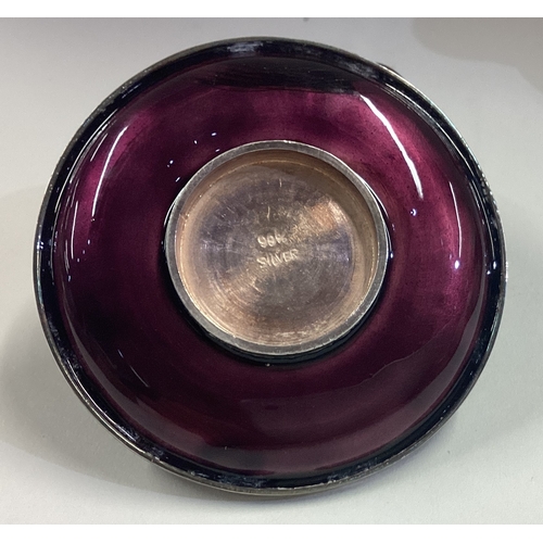 197 - A pair of Asian silver and purple enamelled shot cups on matching saucers. Approx. 200 grams. Est. £... 