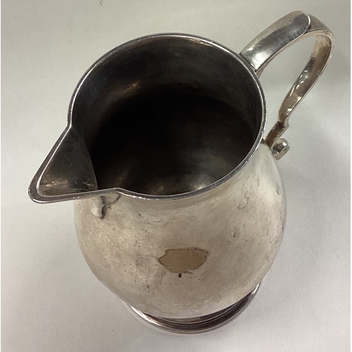 2 - A good heavy silver cream jug in the Georgian style. London. Approx. 245 grams. Est. £60 - £80.