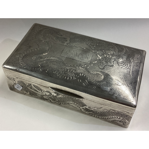 214 - A Chinese export silver cigar box engraved with dragons. Marked to base. Circa 1900. Approx. 401 gra... 