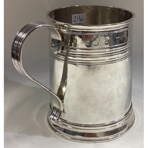 216 - A Queen Anne Britannia Standard silver mug with reeded decoration. London 1709. By William Fleming. ... 