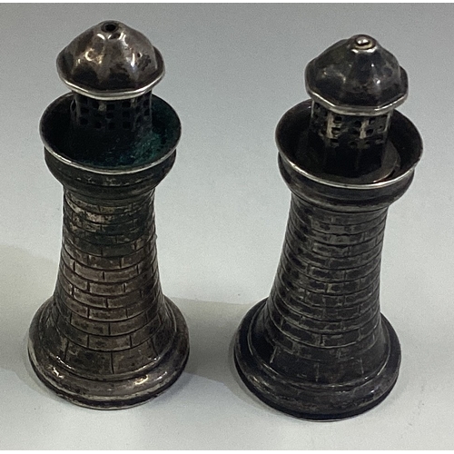 218 - A pair of novelty Victorian silver peppers in the form of lighthouses. Apparently unmarked. Approx. ... 