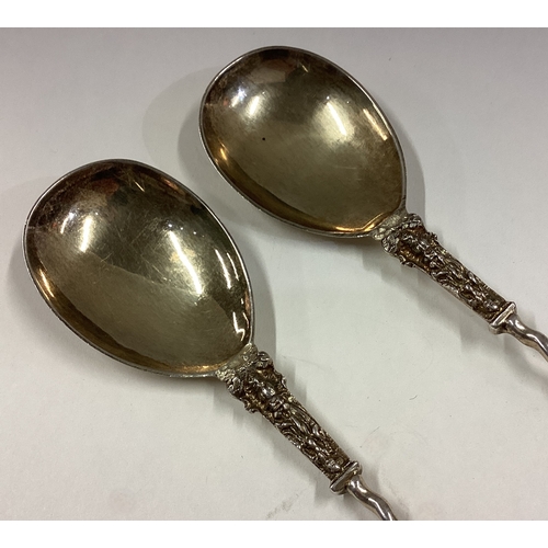 265 - A pair of Victorian silver gilt Apostle top serving spoons. London 1884. By JH. Approx. 91 grams. Es... 