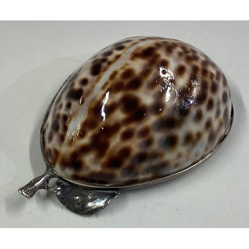 267 - An unusual Continental silver mounted cowrie shell dish in the form of an apple. Approx. 38 grams. E... 