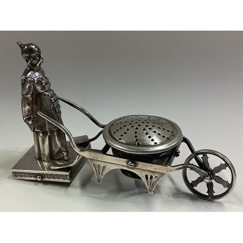 276 - An unusual Continental silver figural pepper pot in the form of an Oriental man with wheelbarrow. Ma... 