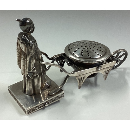 276 - An unusual Continental silver figural pepper pot in the form of an Oriental man with wheelbarrow. Ma... 