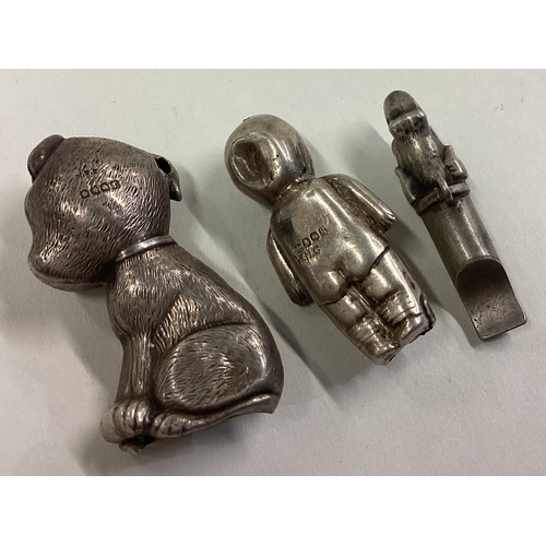 305 - A novelty silver rattle in the form of a child together with a whistle in the form of a dog etc. App... 