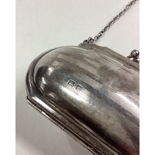 307 - A large engine turned silver purse on suspension chain. Birmingham. Approx. 57 grams. Est. £30 - £50... 