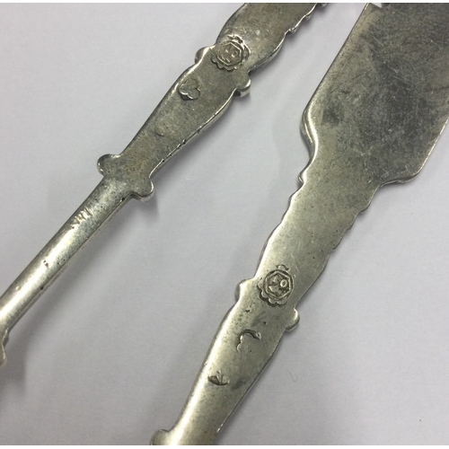 315 - An unusual pair of Antique silver ladles with coins to bowls. Approx. 75 grams. Est. £60 - £80.