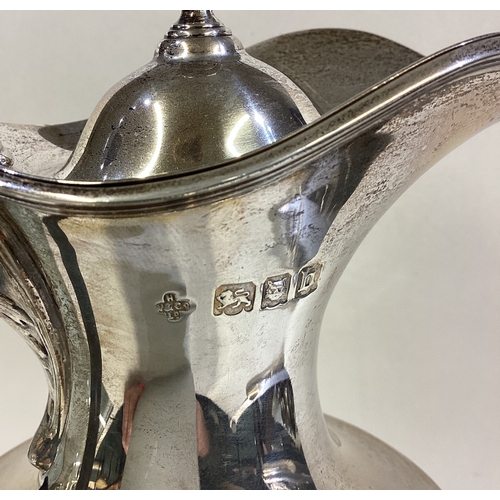 344 - A good silver half fluted water jug with reeded mount. London. By WC. Approx. 456 grams. Est. £200 -... 