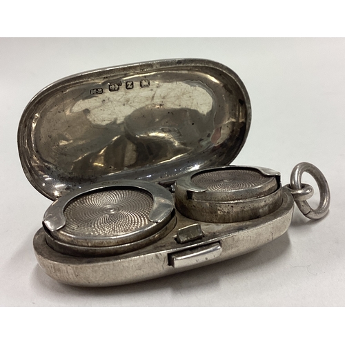 352 - A small oval silver double sovereign case of plain form. Birmingham. By MB. Approx. 32 grams. Est. £... 