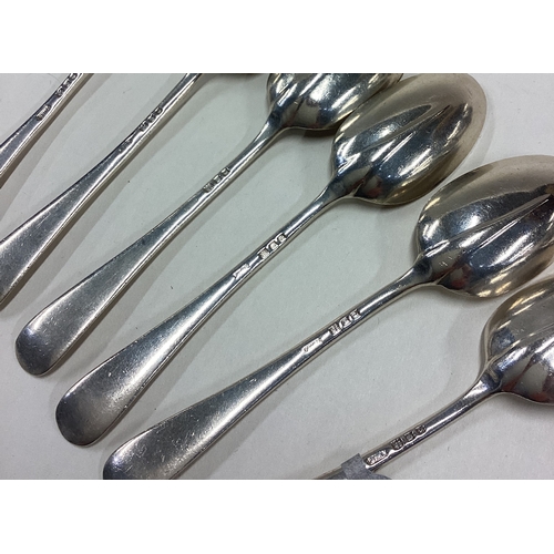 355 - A good set of six silver OE pattern rat tail coffee spoons. London. By JW & Co. Approx. 93 grams. Es... 