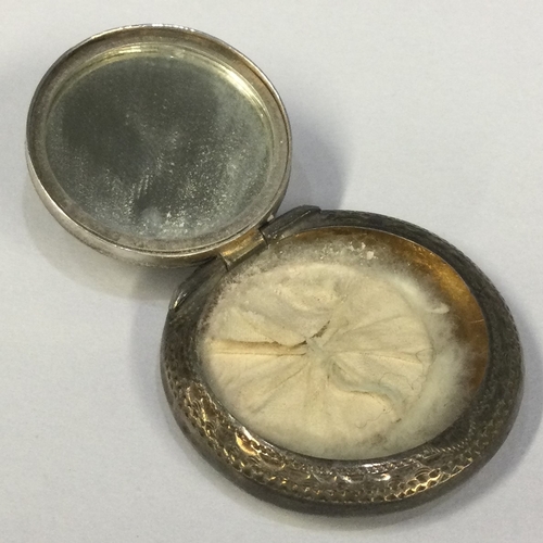 370 - A silver hinged compact with engraved decoration. Birmingham 1913. By ALLD. Approx. 10 grams. Est. £... 