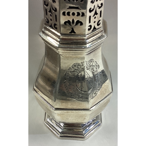 380 - An early Queen Anne silver caster with central armorial. London 1707. By Thomas Farren. Approx. 274 ... 