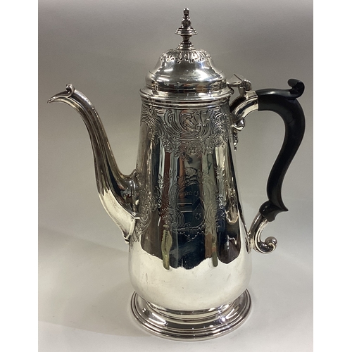 382 - An 18th Century George III silver coffee pot. London 1746. Approx. 754 grams. Est. £800 - £1200.