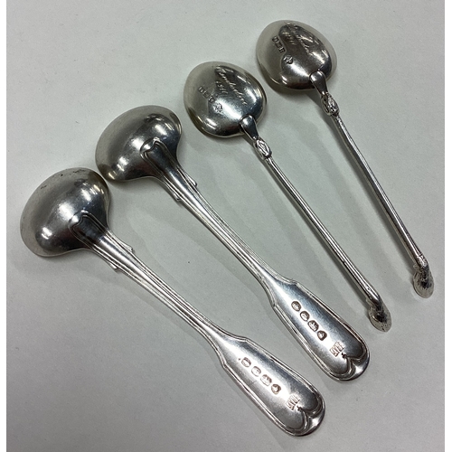 384 - A good pair of silver fiddle and thread pattern salt spoons. London. By JW. Together with a pair of ... 