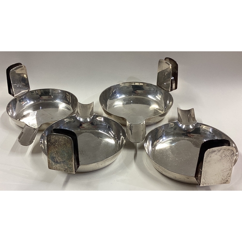 393 - ASPREY: A set of four silver ashtrays. Numbered 1 - 4. Birmingham 1923. Approx. 427 grams. Est. £400... 